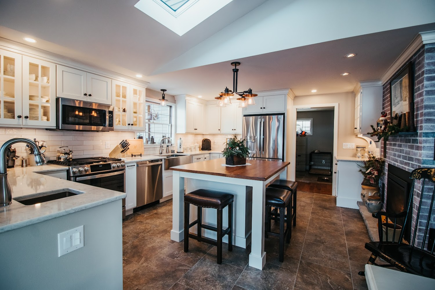 modern-white-kitchen-with-island-and-fireplace